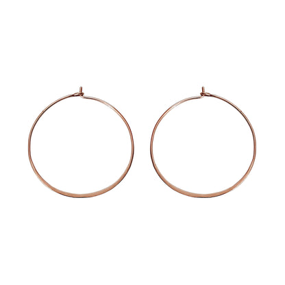 pair of solid rose gold thin hoop earrings 40mm diameter with flattened bottom