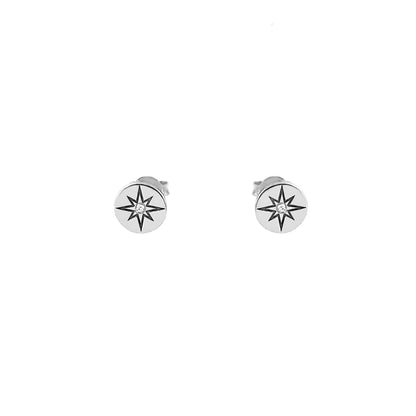 pair of solid white gold north star disc stud earrings set with a tiny diamond in the center