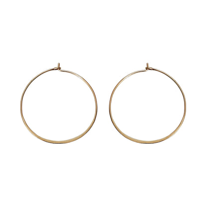 pair of solid yellow gold thin hoop earrings 40mm diameter and flattened bottom