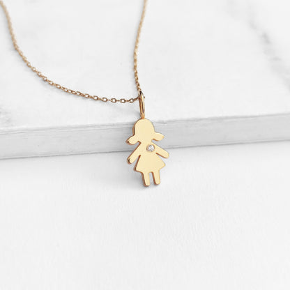 yellow gold necklace with tiny girl outline charm set with tiny diamond