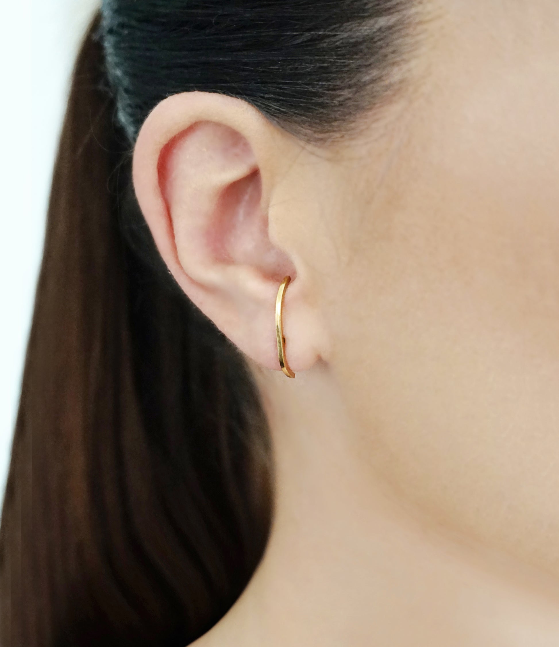 woman wearing 25mm solid yellow gold earlobe cuff suspender earring