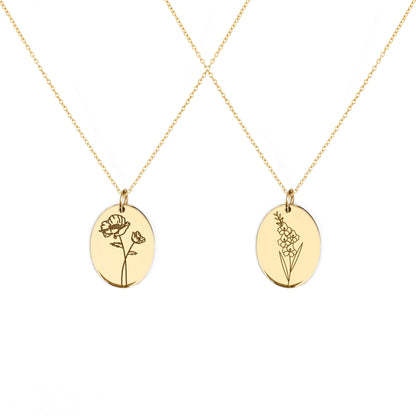 two solid yellow gold oval pendant necklaces engraved with the birth flowers of August Poppy and Gladiolus