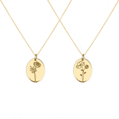 two solid yellow gold oval pendant necklaces engraved with the birth flowers of October Marigold and Cosmos