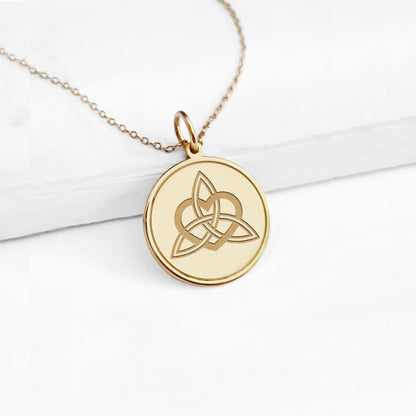 14k yellow gold disc pendant necklace engraved with a triquetra everlasting love celtic knot with a circle frame around it